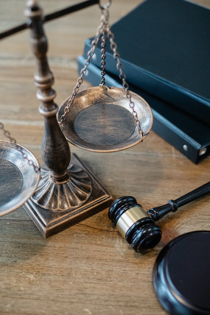services-02 From above of judicial symbols consisting of Scales of Justice and small judge hammer with curly handle