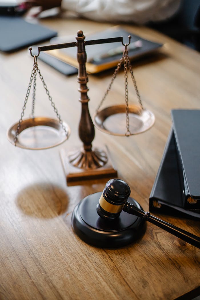 services-03 High angle lawyers desk with decorative judgement scales and gavel in modern law firm